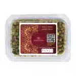 Fresh spicy fried green peas in clear plastic container, ideal for snacks and healthy eating.