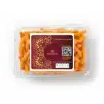 Crispy Schezwan snack sticks in clear plastic container with Modison branding.