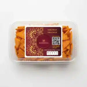 Golden Shezwan Triangle Snack, packed in transparent container with branding.
