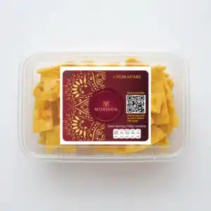 Golden crispy chora fari snack in clear plastic container, MODISON branding.